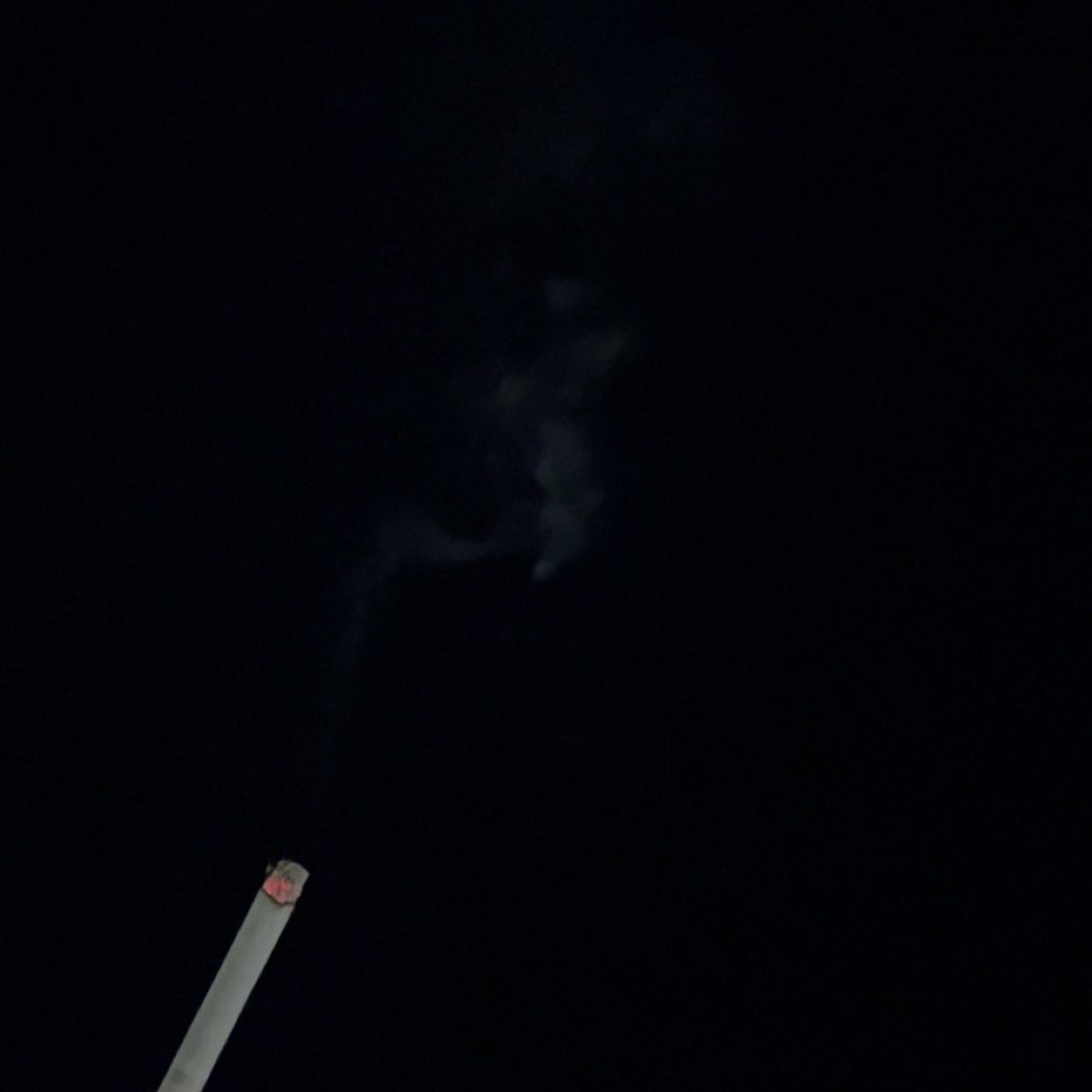 A man lit a cigarette into the night sky on November 31, 2023. This presents what to avoid doing in someones free time. 
