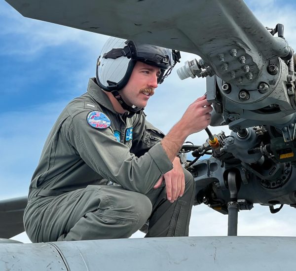 Griffin Hinkley administers a preflight inspection of his MH-60R helicopter while aboard the USS Gravely in March 2022. The USS Gravely was conducting deployed flight operations in the Mediterranean Sea. Photo used with permission from USS Gravely flight crew. 