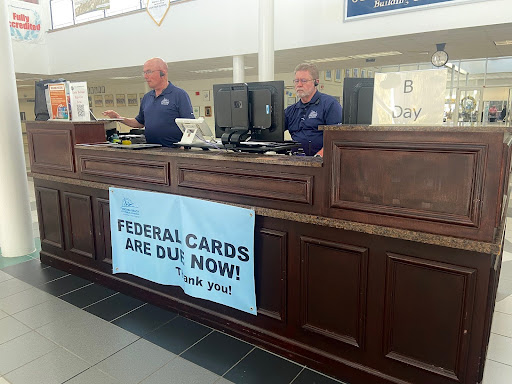 Security assistants David Bretchel and John Borman work security at the front desk at Ocean Lakes High School during third block on Nov. 29, 2023.
