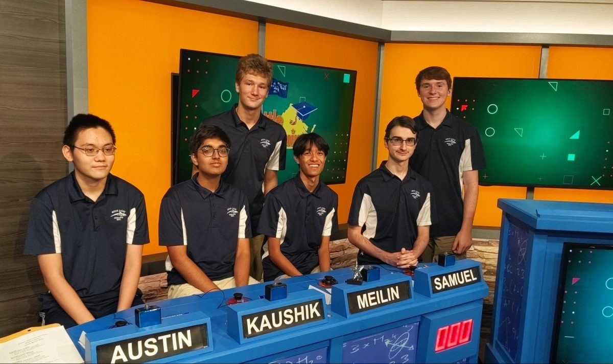 The+Battle+of+the+Brains+team%2C+composed+of+scholastic+bowl+members%2C+is+all+smiles+at+the+competition+in+Richmond%2C+Va.%2C+on+Oct.+5%2C+2023.+From+left+to+right%3A+Austin+Mao%2C+Kaushik+Tatta%2C+Jackson+Crickard%2C+Meilin+Ranjan%2C+Samuel+Kidd+and+Clark+Smith.+Photo+used+with+permission+from+Miranda+Blaser.