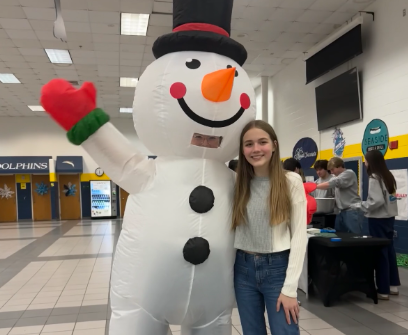 Sophomore Lily Stewart  and Snowman enjoy the Winter Carnival in the cafeteria on  Friday, Jan. 19, 2024. Photo used with permission from Khadija Sissoko.