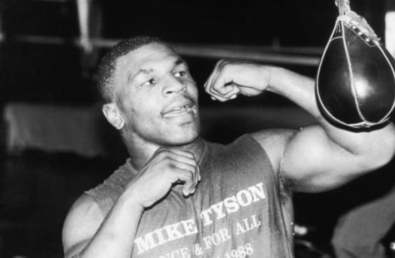 American boxer Mike Tyson prepares for his upcoming match against Michael Spinks by hitting a speed bag at Trump Plaza. (Tyson Trains/William E. Sauro/Getty Images)