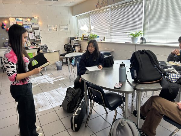 Forensic team prepares for regionals during One Lunch on Jan. 18, 2024. Isabella Ragasa practices her speech with fellow members, Sophia Tanenggee, Arjun Padiyar, and Sarah Kosovsky.