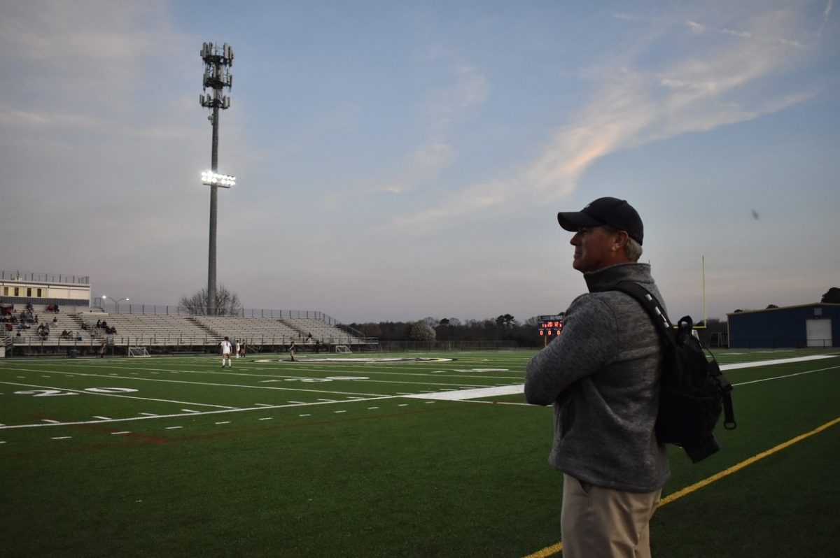 Head+athletic+trainer+David+Lehan+stands+on+the+sideline+on+March+14%2C+2024%2C+during+the+boys+soccer+game+against+Grassfield+at+Ocean+Lakes+High+School.
