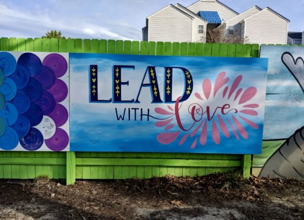 Nuenzs mural, Lead with Love rests on the fences of the ViBe district. Photo used with permission from Ceindy Nunez.