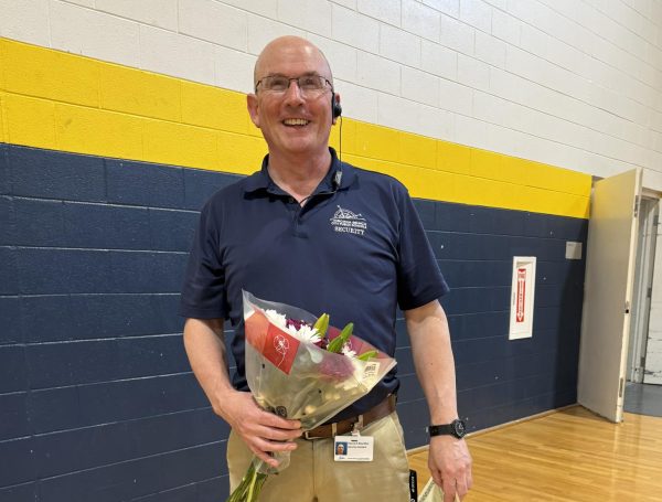 Adored security guard, Dave Brechtel, wins the 2024 assistant of the year award at the spring sports assembly on March 29, 2024. The finalists for the award were eight Ocean Lakes staff members: Dave Brechtel, Shella Everett, Tammy Gravier, Elizabeth Guidry, Amy Lucas, Barry Mitchell, Jay Seacrist and Crystal Wright. 