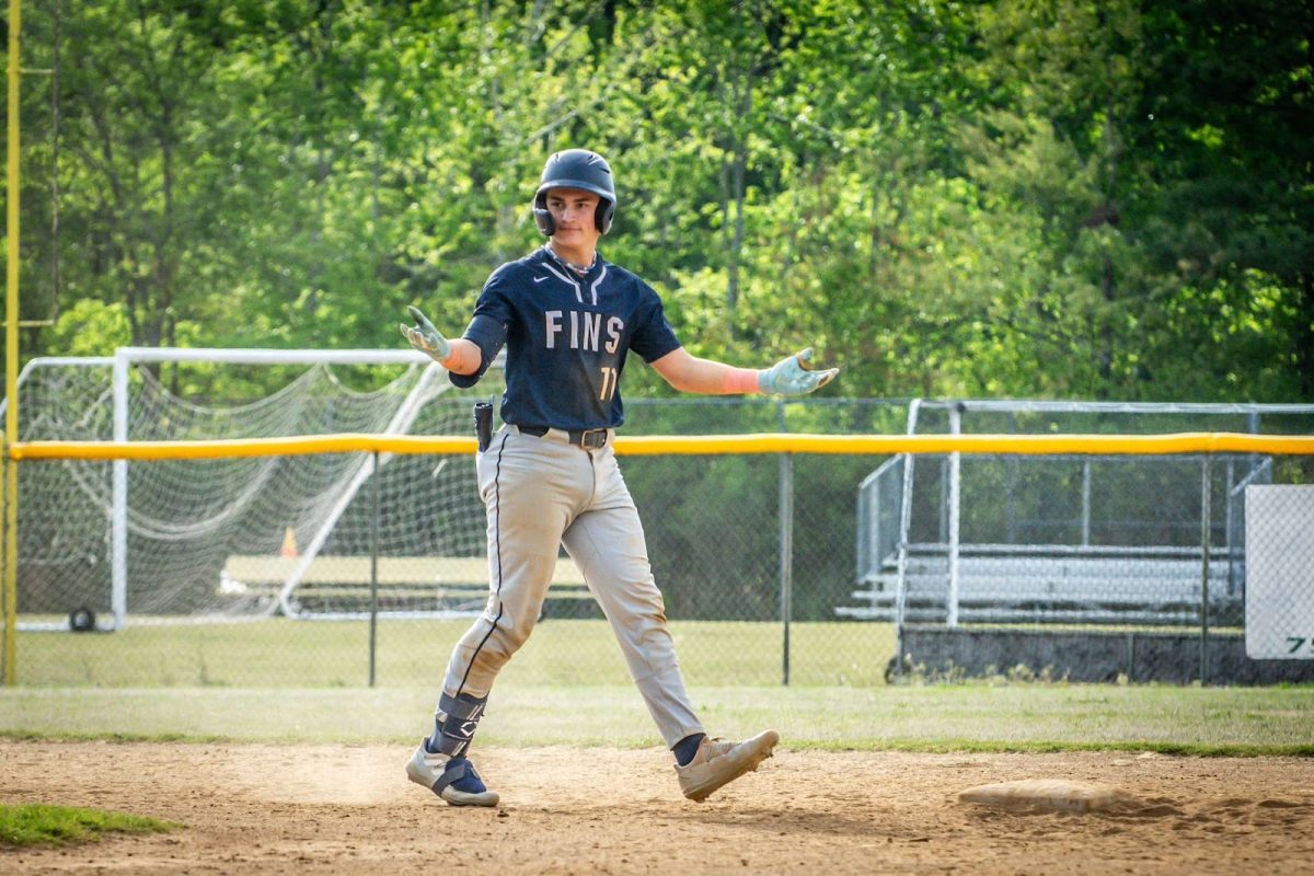 Junior+Ryan+Gocio+celebrates+after+completing+a+double+during+the+second+inning+against+Tallwood+High+School%2C+at+Tallwood+High+School+on+April+19%2C+2024.+He+had+a+three-run+game.+Photo+used+with+permission+from+Melanie+Meneses.+