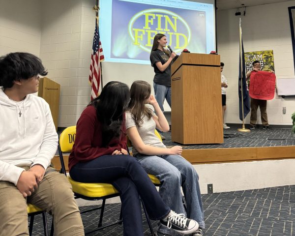 On Apr 9, 2024, the class of 2027 representatives listen to senior Chloe Minnis, the Fin Feud MC and organizer, as they prepare to vs. the class of 2025.