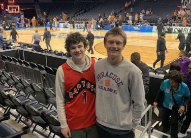 From left to right: junior Nash Phillips and senior James Cummings attend the Texas vs. Tennessee game at Spectrum Center. It was played during the second round of the NCAA March Madness Tournament on March 23, 2024. 
Photo used with permission from James Cummings.