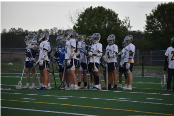 Dolphins warm up for their game against Kempsville at Ocean Lakes on April 12, 2024. Photo used with permission of Jade McAboy.
