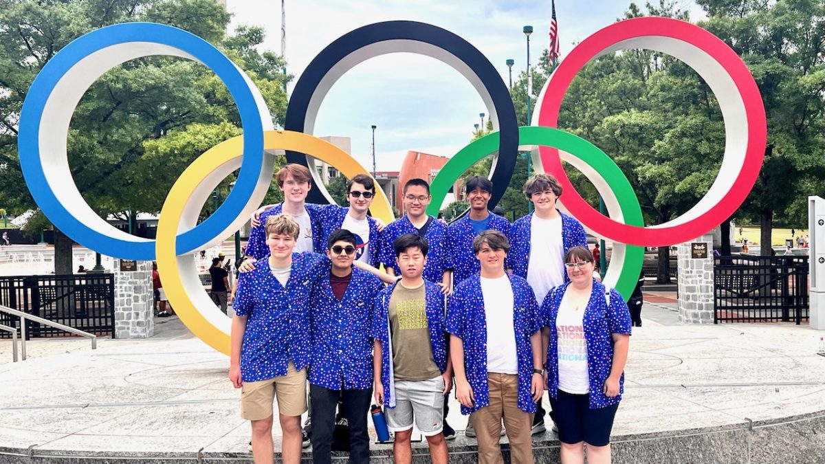 The Scholastic Bowl Team stands in front of the Olympic rings of Centennial Olympic Park in Atlanta, Ga., ahead of the NAQT High School National Championship Tournament on May 25, 2024. From left to right, from top to bottom: Clark Smith, Samuel Kidd, Austin Mao, Meilin Ranjan, Cole Graninger, Jackson Crickard, Kaushik Tatta, Rockwell Li, Frankie Graninger, and Miranda Blaser.
Photo used with permission from David Smith.
