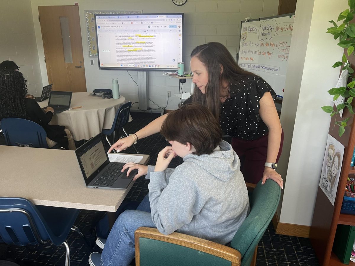 English teacher Carol Buckly holds a writing class for students on May 2, 2024 at Ocean Lakes High School. She instructs junior Evelyn Vargas with her assignment to prepare for upcoming summative assessment. 

