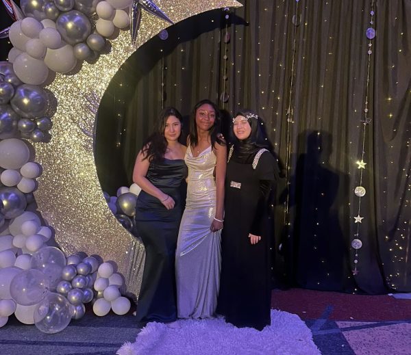 From left to right: seniors Vanessa De La Cruz, Toni G Hill and Reyhan Akkale immerse themselves in the midnight magic of prom held at the Virginia Beach Convention Center on June 8, 2024. The decorations, prepared by English teachers and class sponsors Thomas Stewart and Shelby Wyatt, added to the magical night. Photo used with permission from Jayden Egan.