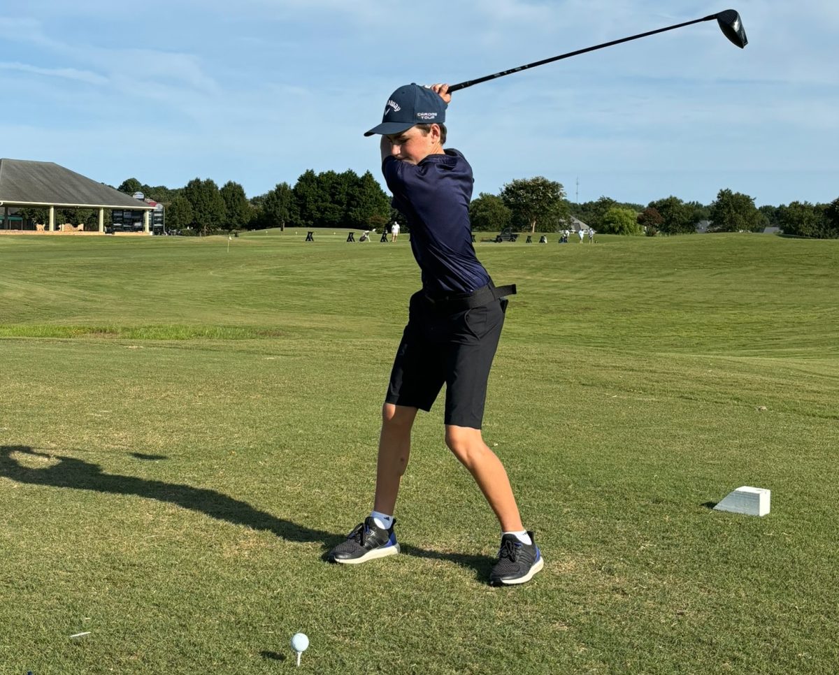 Junior Kieran Danbuksy prepares to swing his golf club during a match at Heron Ridge Golf Course on Aug. 22, 2024. Photo used with permission from Dan Barger.