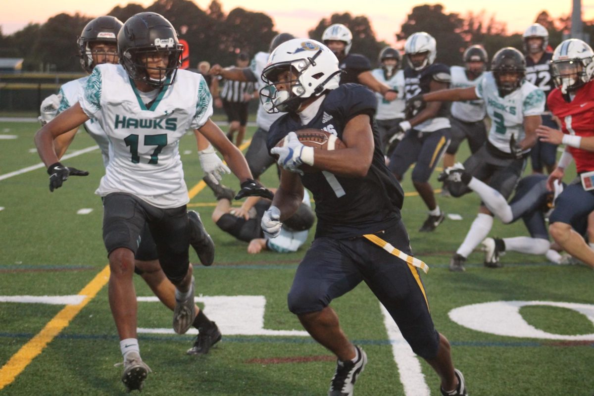 Senior Devin McGill rushes to endzone for a touchdown during a scrimmage against the Hickory Hawks at Ocean Lakes High School on Aug. 22, 2024.