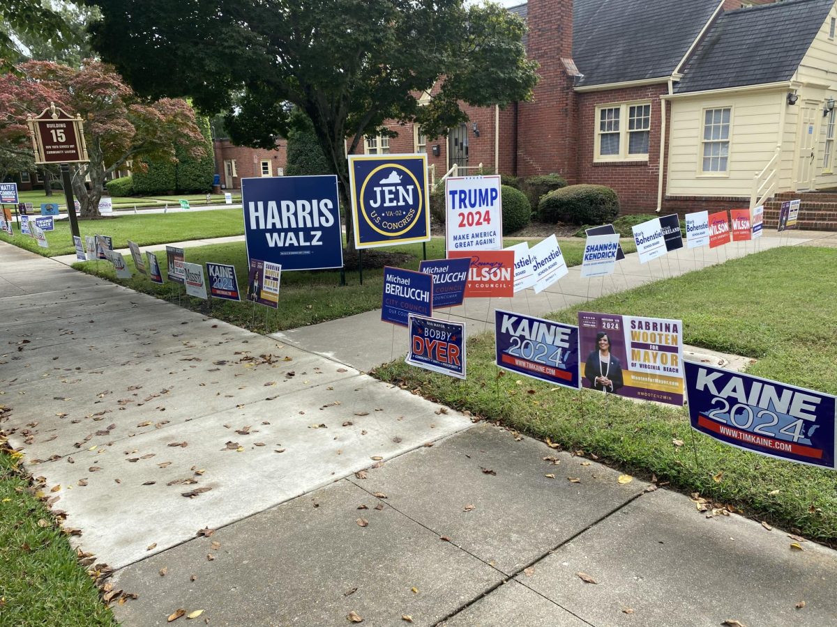 Political signs cover the lawn of the early voting destination at the Virginia Beach Courthouse on Sept. 25, 2024. Prospective voters should await information on their polling location, which typically comes out between two and four weeks before the election. 