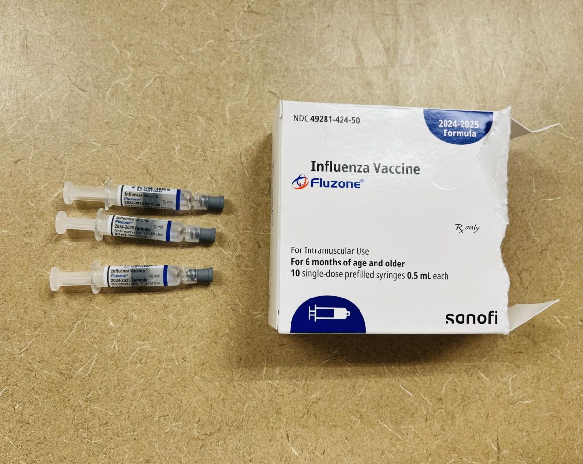 Flu vaccines rest on the counter of a CVS Pharmacy shortly after being unboxed on Sept. 18, 2024. Flu season begins in October and peaks between December and February.