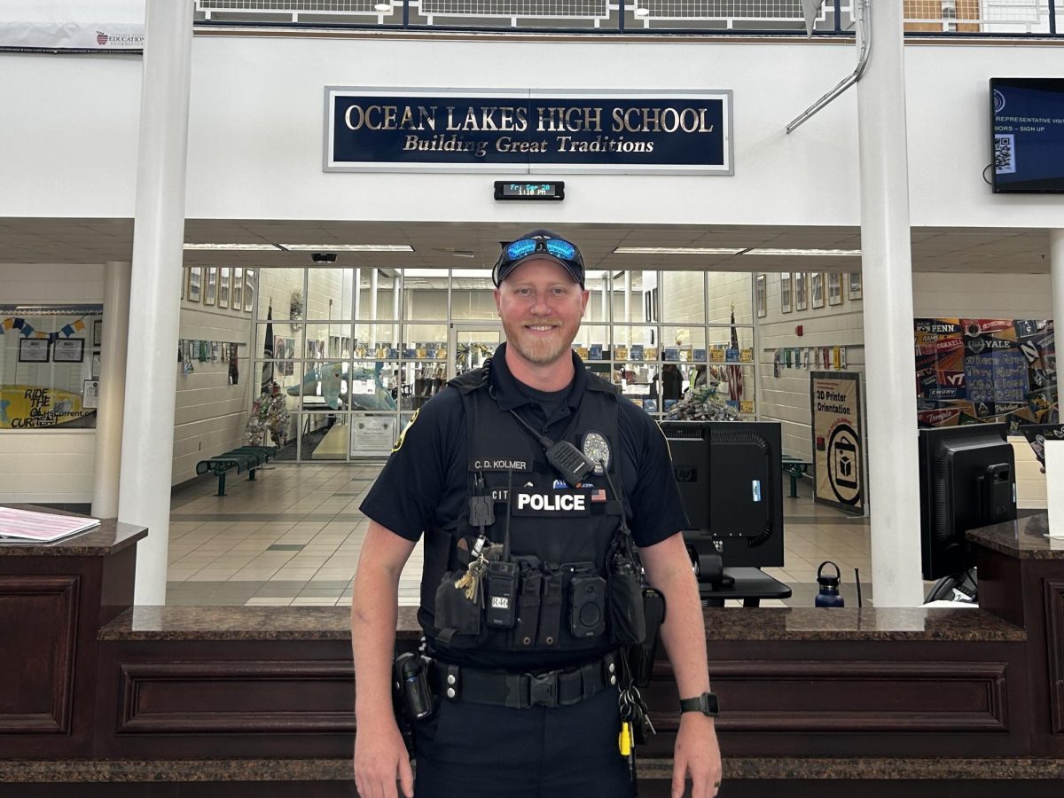 School resource officer Cameron Kolmer stands at the security desk awaiting any student or staff that may need his assistance on Sept. 20, 2024. “I enjoy being able to be there for everyone whether it is at their highs or at their lows,” Kolmer said.