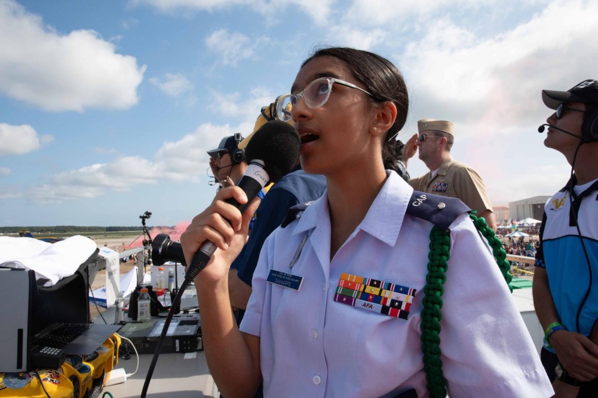 Mihika Sakharpe sings the Star Spangled Banner in her Civil Air Patrol uniform at the 2024 Oceana Air Show on Sept. 22, 2024. Mihika sung at 10:45 a.m. on Friday and Saturday and at 11:15 a.m. on Sunday due to forecasting. Photo used with permission from Naval Air Station Public Affairs.