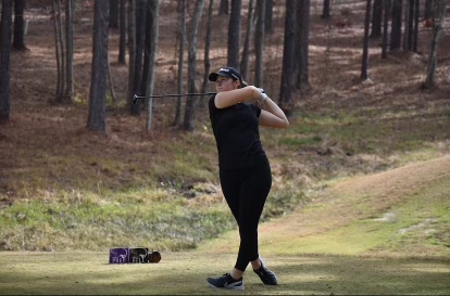 Freshman Kaylee Bell swings her golf club at Forest Creek Country Club in North Carolina on Dec. 10, 2023. Photo used with permission from Kaylee Bell.