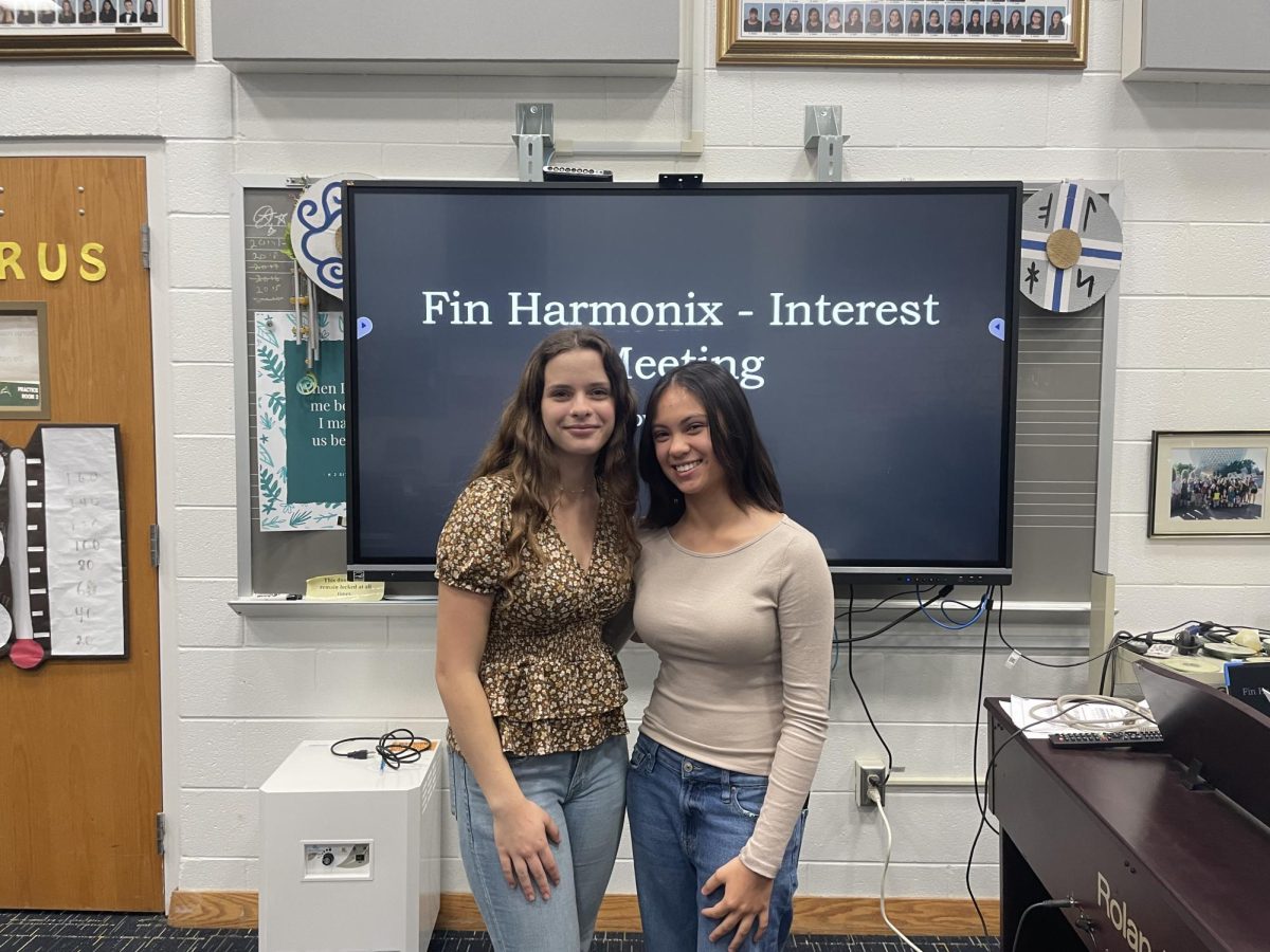 Fin Harmonix president Mia Fruit and vice president Anna Lewis welcome new faces to their interest meeting on Nov. 7, 2024.

