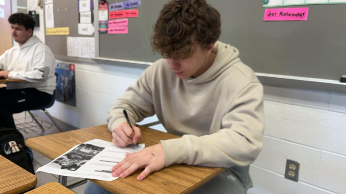 Junior Evan Quarrels works on a missing assignment during lunch in Room 253 on Oct. 28, 2024.