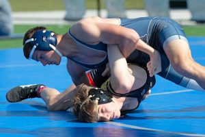 Senior Paul Chapman wrestles a competitor from Kellam High School at The Trick or Turf Tournament at Ocean Lakes High School on Oct. 26, 2024. The tournament was open for elementary, middle and high school wrestlers. Photo used with permission from Paul Chapman.
