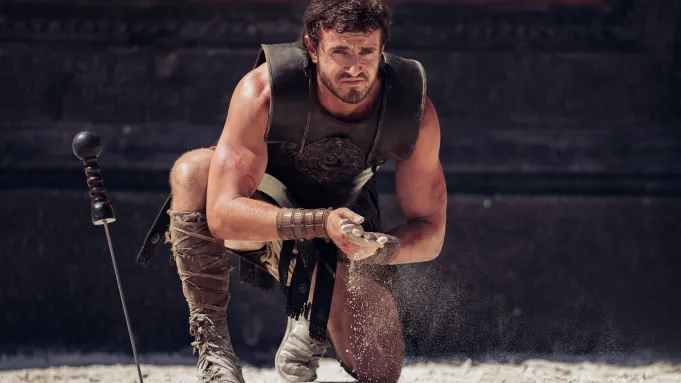 Lucius Meridius, played by Paul Mescal, prepares to fight. He covers his hands in sand in preparation to battle a rhinoceros. Courtesy of Paramount Pictures.
