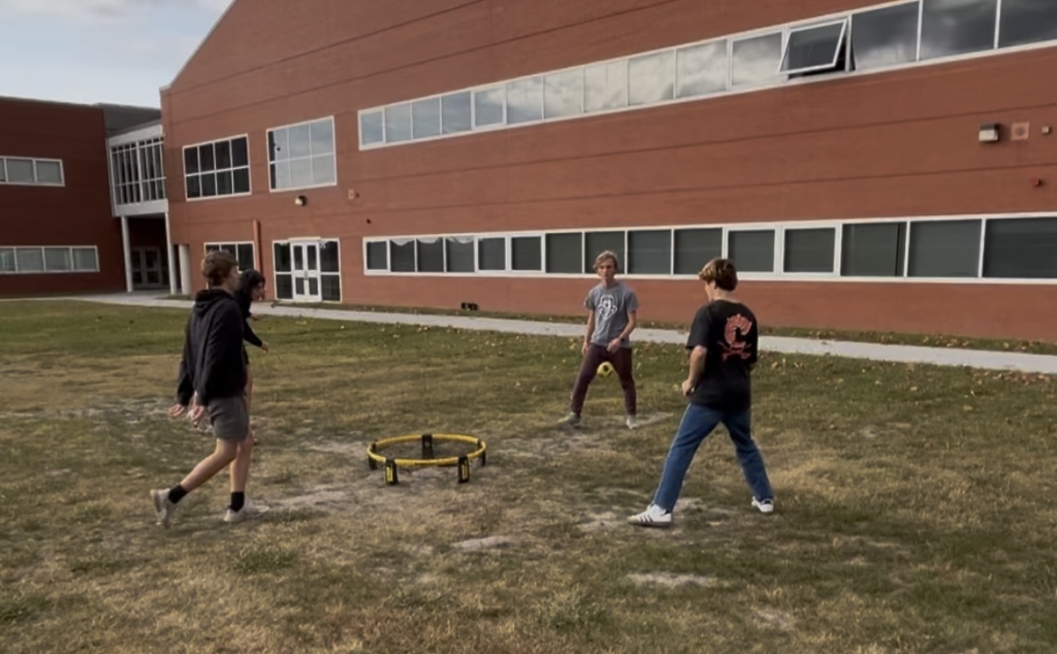 Sophomores Jack Kane and Kaleb Blanchard, junior Victor Hovenessian and senior Evan Grabarczyk enjoy a game of spikeball after school on Nov. 13, 2024. 