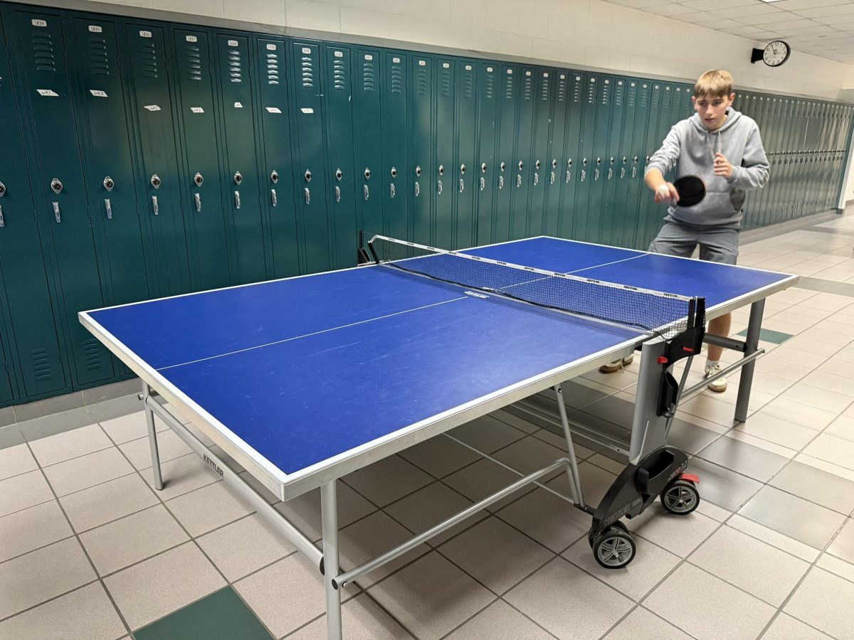 Junior Victor Hovanessian volleys the shot by the opposing player on Dec. 17, 2024.