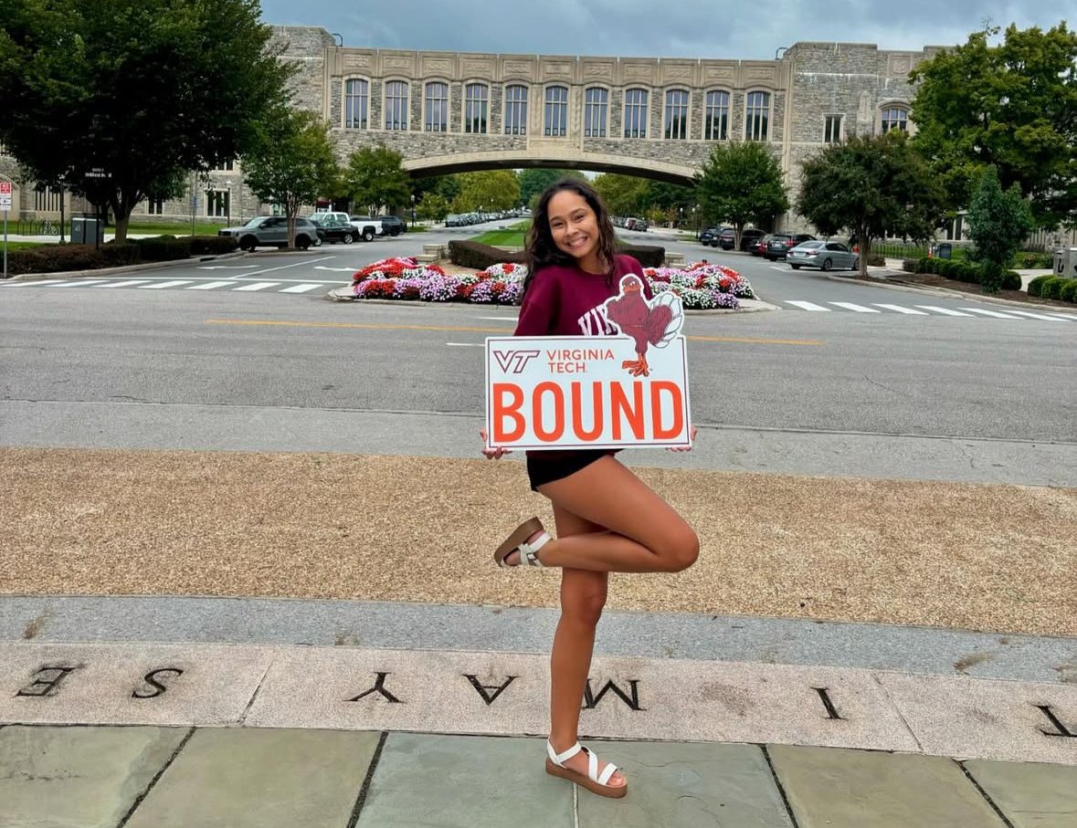 Senior Valeria Rosado excitedly holds her "VT Bound" poster on Sept. 29, 2024, in front of VT's Torgersen Hall. VT has 15 degree programs for students interested in pursuing engineering. For more information, visit eng.vt.edu/academics. Photo used with permission from Valeria Rosado.