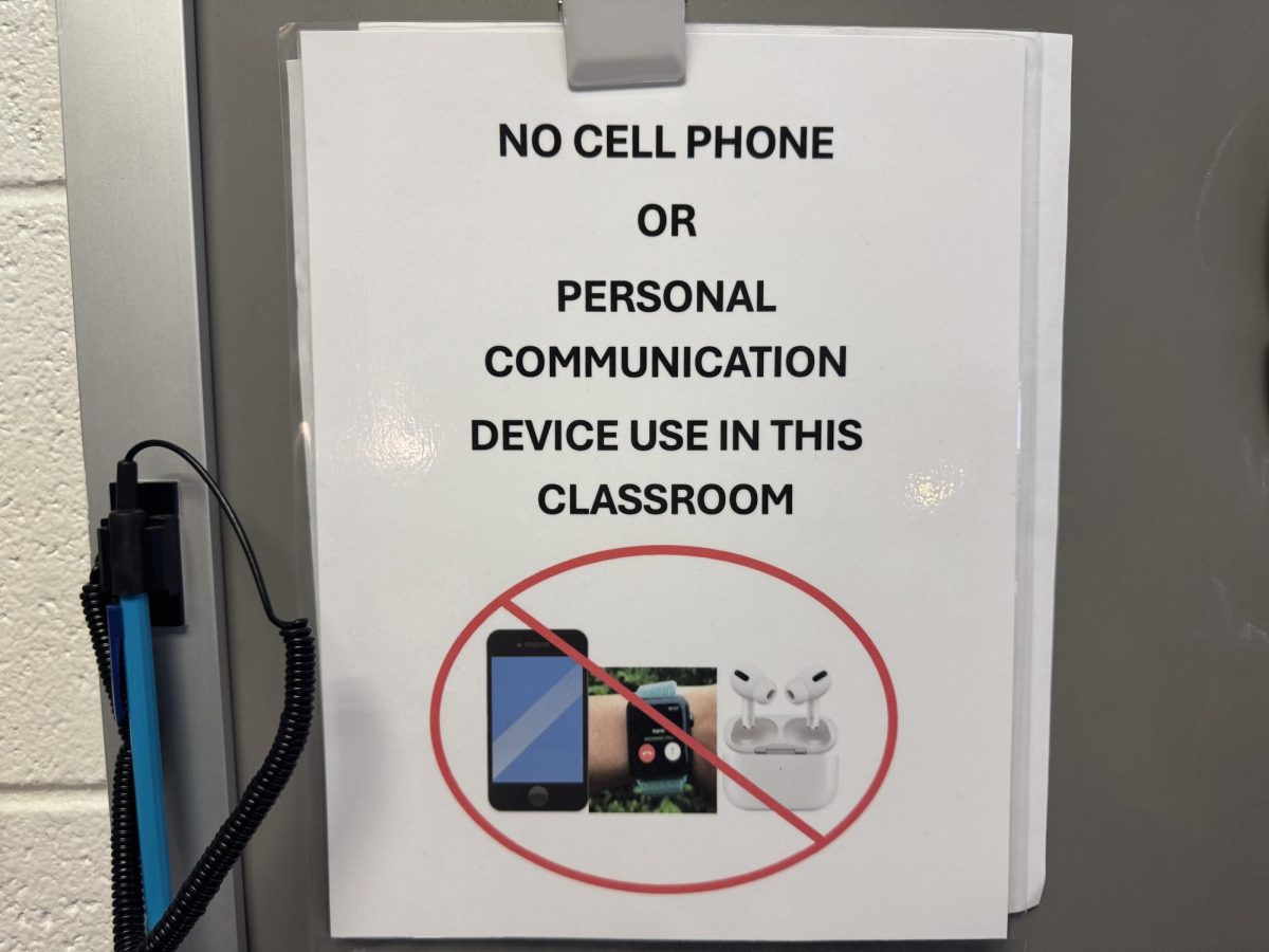 A "no cell phone" sign hangs at the front of Fara Wiles' classroom on Jan. 28, 2025. With the implementation of the new policy, rules concerning cellular devices have become more strict and widespread.