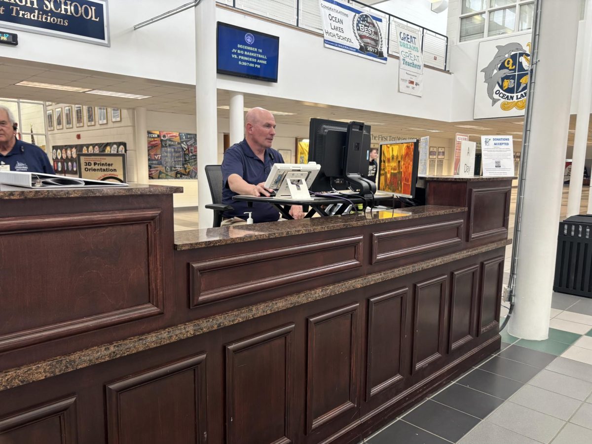 Assistant security guard David Bretchel works at the security desk in the main Fourier during fourth block on Dec., 17th, 2024. This is where students go to verify their identity with an identification card, StudenVue or Synergy identification number.