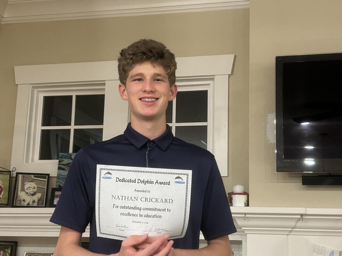 Freshman Nate Crickard earns a Dedicated Dolphin certificate for his hard work in Jennifer Estabrook's MSA Chemistry class at Ocean Lakes High School in November 2024. Photo used with permission from Colin Crickard on Dec. 5, 2024.