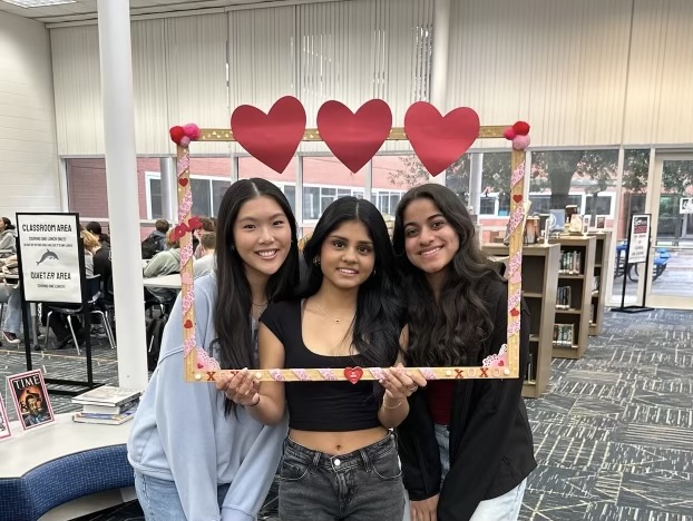 Juniors Selina Zhang, Aanya Patel, and Anisha Warusavitharana gather in the library as they celebrate Valentine's Day on February 12, 2025.