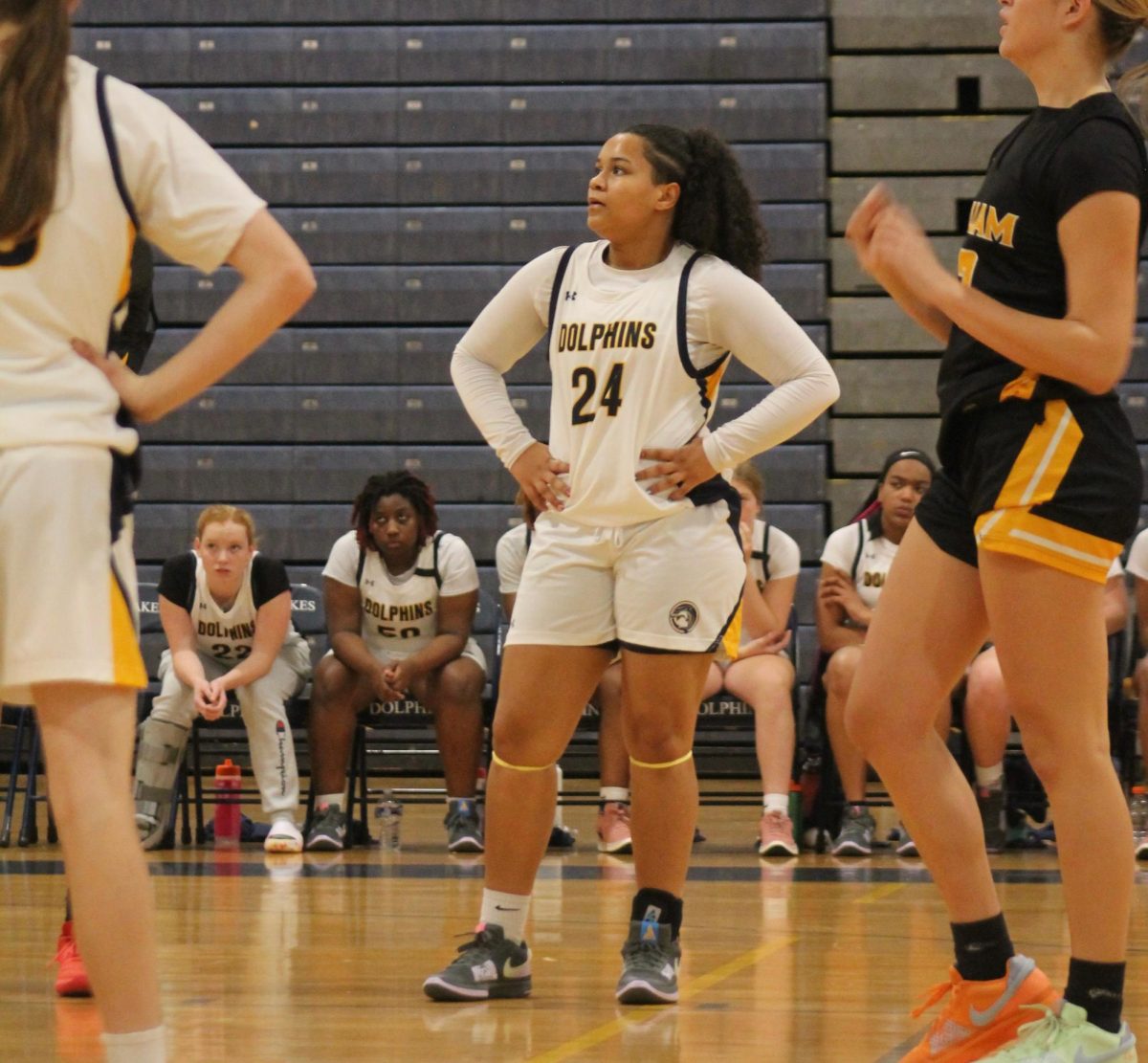 Junior Jasmyn Miller watches as the opposing team, Kellam High School, shoots from the free throw line at Ocean Lakes High School on Dec. 13, 2024. The Dolphins took a loss with a final score of 43-68, Jasmyn scored a total of 19 points.