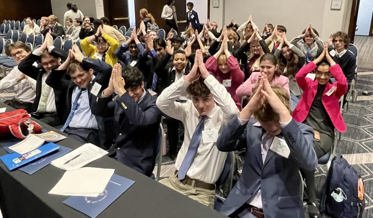 Ocean Lakes delegates show their fins at ODUMUN on Feb. 14, 2025, during the conference’s opening ceremony. This was a larger group compared to last year’s team. Photo used with permission from Lisa Gibson. 

