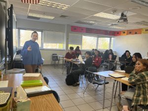 Geometry teacher Stephanie Gentile shows her class their daily warm-up on Jan. 30, 2025. It took Gentile around five minutes to gain the class’ attention to the board. 