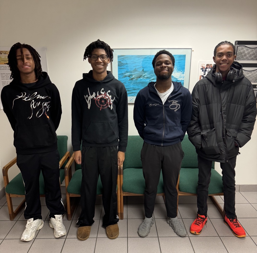 From left to right: Jahlill Norton, Zavier Mayfield, Jamarie Sanders and Rhys Williams gather after the African Male Summit hosted at Green Run High School on Jan. 25, 2025. Photo used with persimmon from Amanda Malbon.