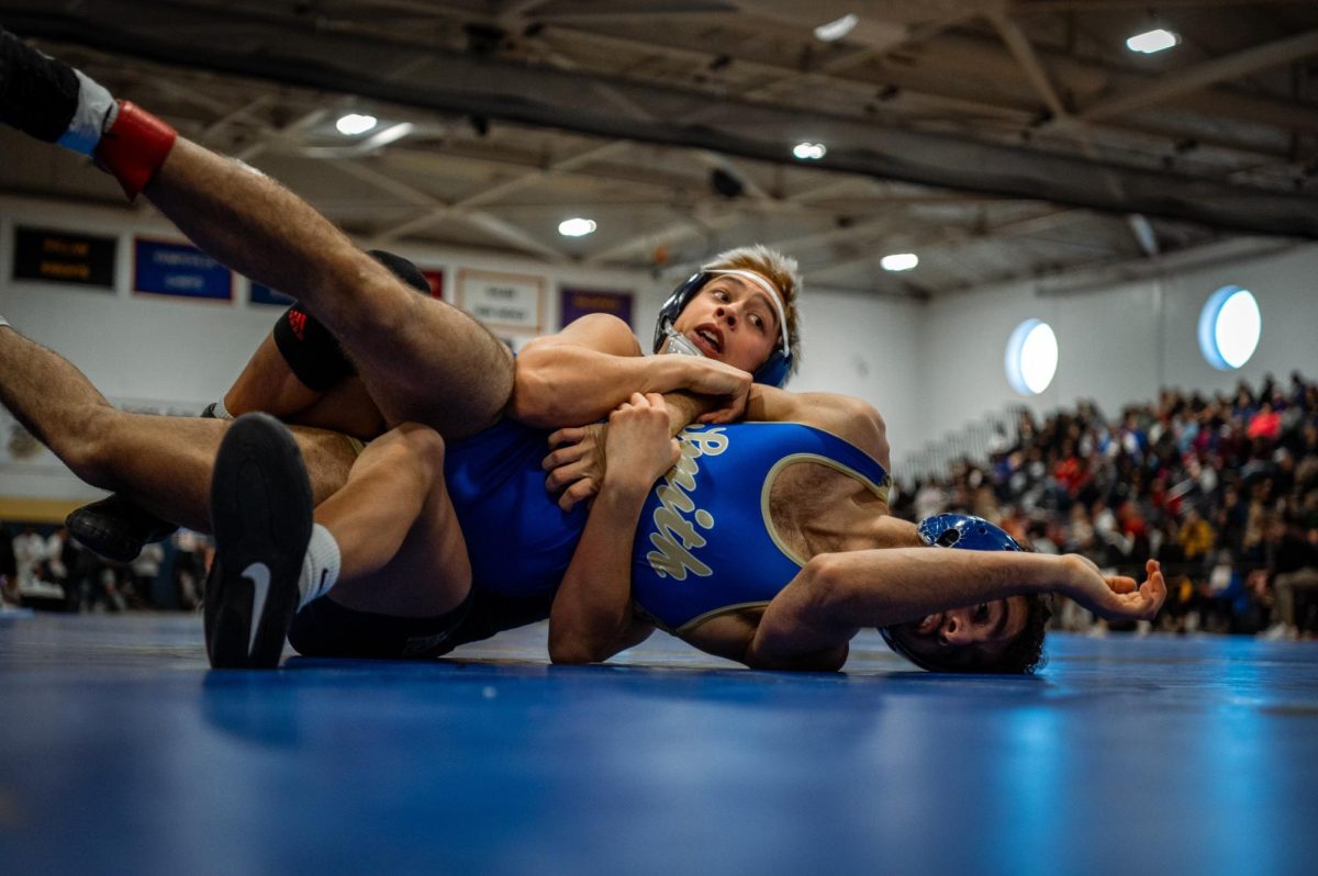 Senior Chris Castillo battles for a win at the John Kelly Invitational. At the end of the tournament, Chris placed fifth overall. Jan.25, 2025. Photo used with permission by Eric Aamodt.