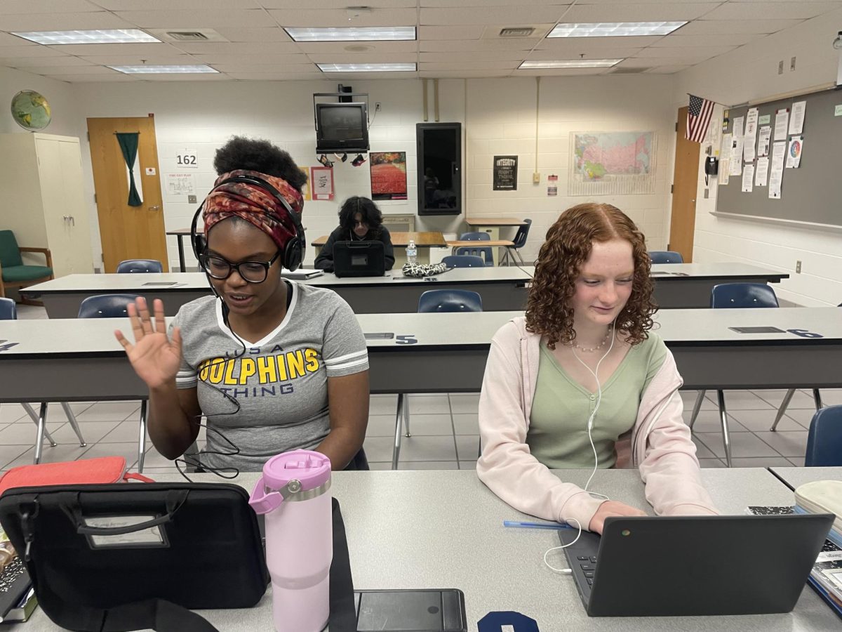 From left to right: Khabida Inniss, Jason Harding and Ella Mathis log on to a world language google meet class on March 13, 2025. AP French and Japanese IV are just some of the many distance learning classes offered. 
