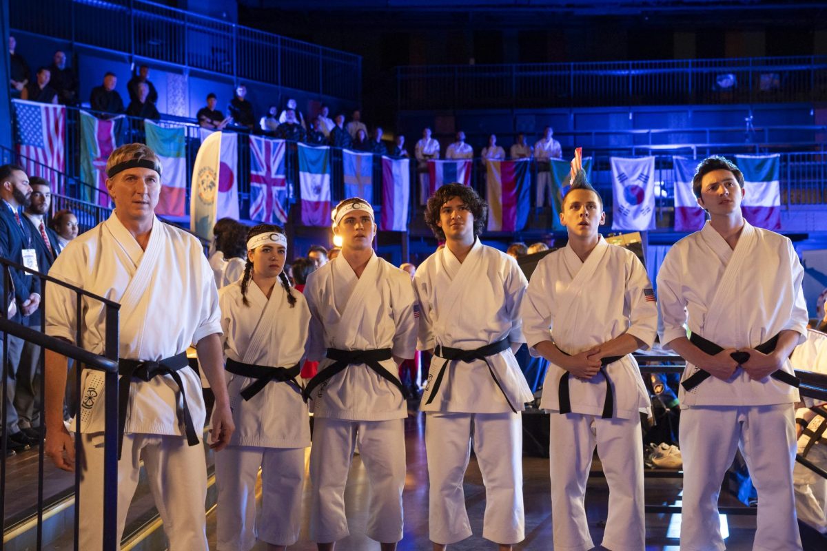 Pictured from left to right: Johnny Lawrence (William Zabka), Samantha LaRusso (Mary Mouser), Robby Keene (Tanner Buchanan), Miguel Diaz (Xolo Maridueña), Eli Moskowitz (Jacob Bertrand) and Demetri Alexopoulos (Gianni DeCenzo) await their overall score at the Sekkai Tekai, an international competition. In the series, Johnny Lawrence and his students joined Miyagi-Do to take down “Cobra Kai,” unaware that their real enemy is the Terry Silver-led Iron Dragons. Courtesy of Netflix.