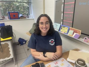 A picture of Natalie Kasmarek smiling in her classroom taken on March 7, 2025. She has almost completed her first year of teaching.