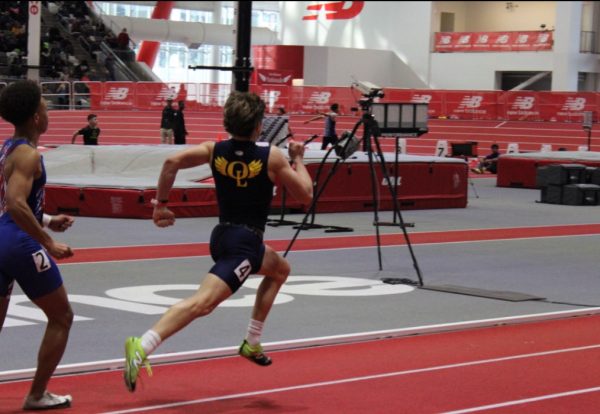 Freshman Isaac Richardson passes his competition in the 400 meter dash. Isaac ran in lane 2, finishing with a time of 51.76. Photo used with permission by 