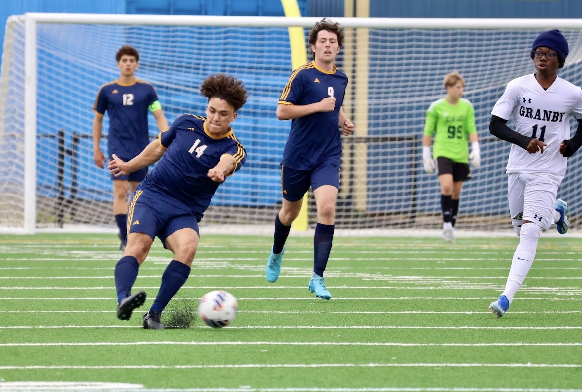 Junior Gabe Teeter takes the ball and clears it up to the Dolphin’s offense on May 21, 2025. The team went on to win 2-0. Photo used with permission by Amanda Marrone.
