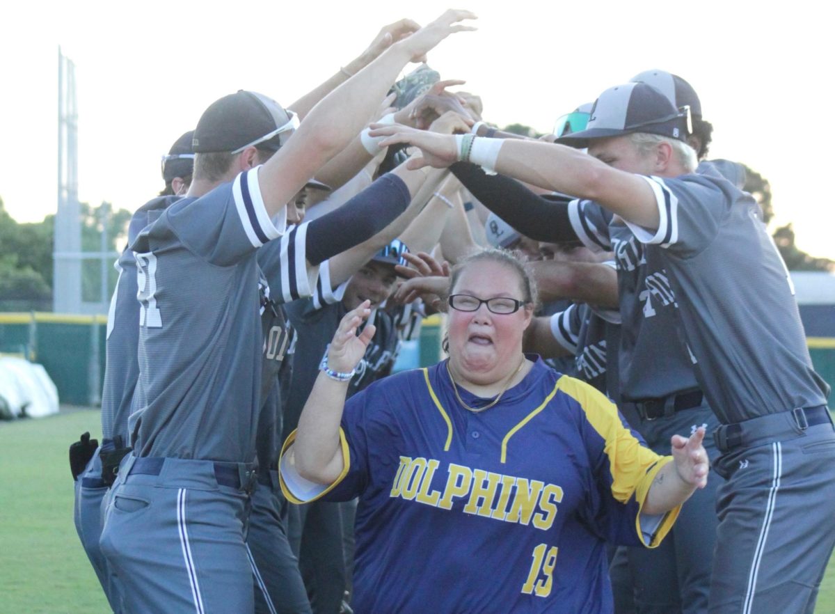 Baseball team creates tunnel as a way to celebrate Lindsey (Lou) Brown's contributions to the team during their senior night game on May 22, 2025, at Ocean Lakes High School. The boys defeated Norview High School 10-0.