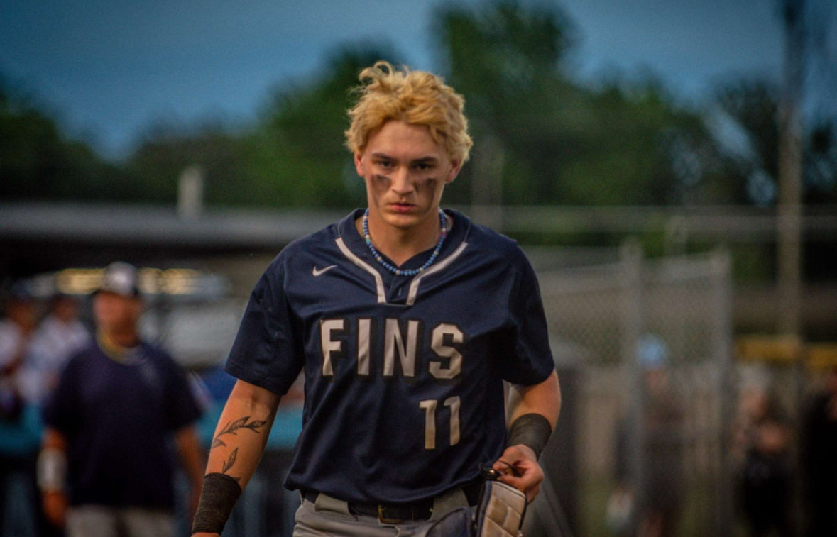 Senior Ryan Gocio mentally focuses for his home baseball game on May 24, 2024, against Great Bridge High School. The boys took home another win after defeating Great Bridge 12-5. Pictured is Gocio wearing the necklace his sister Lou Brown made him. Photo used with permission by Melanie Meneses.