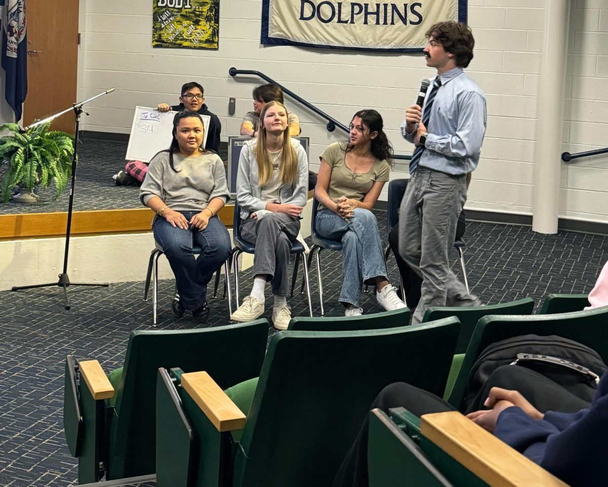 From behind: juniors Henry Nguyen and Josh Ng kept track of points for the competition. The competitors for the senior class from left to right are Gillian Gutierrez, Lauren Bulleigh, Grace Melendez and Nina Elizondo. Senior Thomas Dillard role-played as Steve Harvey. Picture was taken on April 24, 2025.