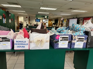 In this photo, boxes full of handcrafted pillows lay nice and neat ready to be taken to the children at Ronald Mcdonald House. Photo used with permission by Karen Simmons.