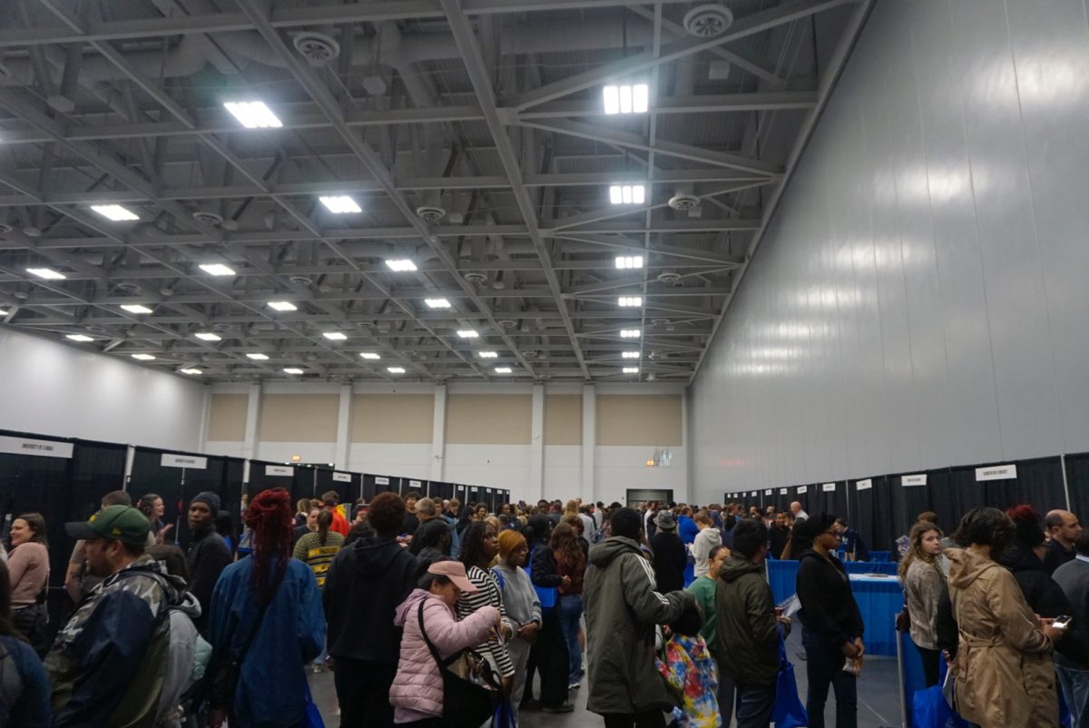 Families scavenge for college booths suiting their childs interests on Oct. 28, 2025. Each booth is accompanied by a knowledgeable and welcoming spokesperson.